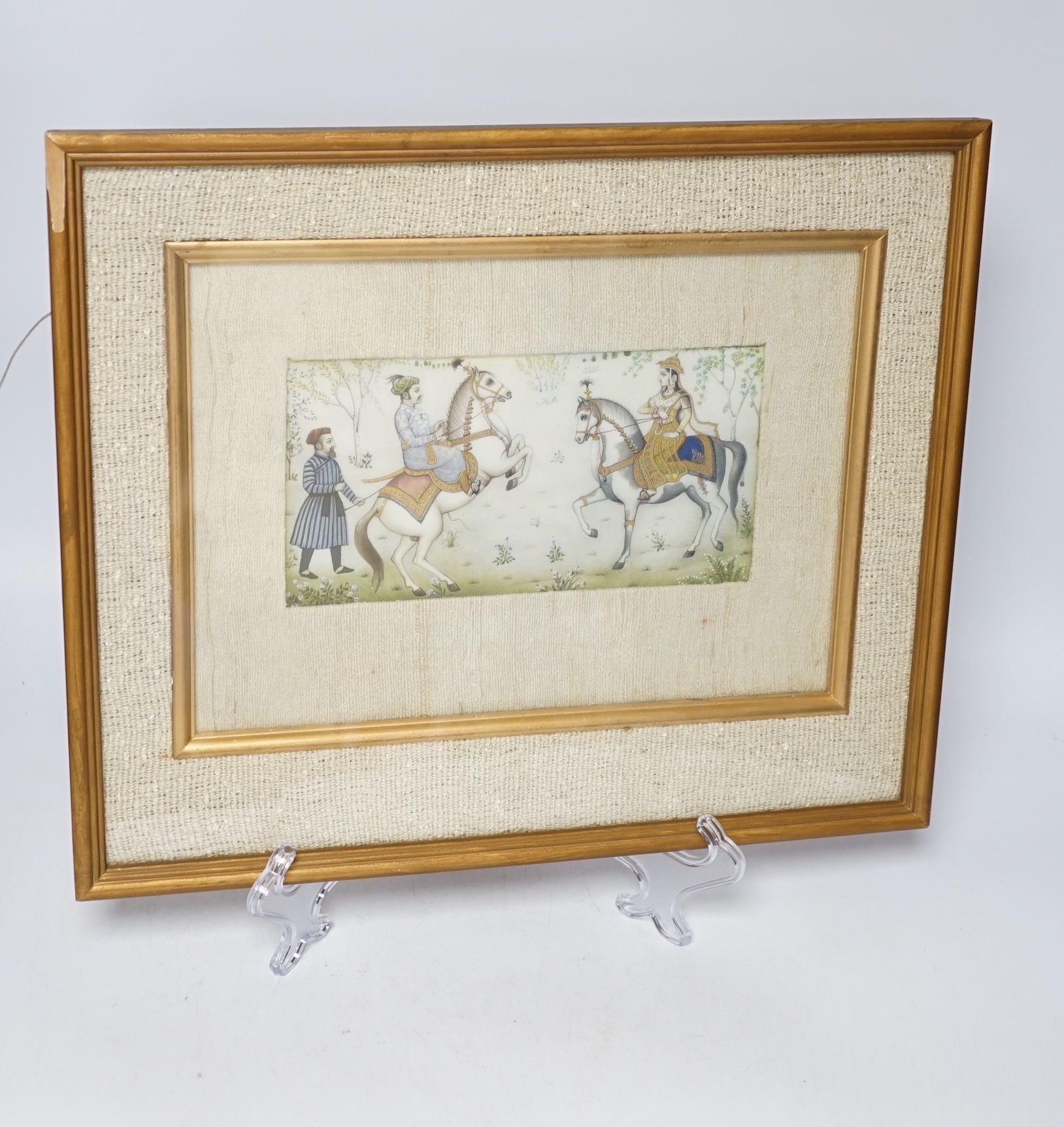 Indian Mughal style miniature on ivorine, 20th century depicting Shah Jehan - Mumtaz Ali on horseback, glazed frame, 20cm wide x 10cm high
